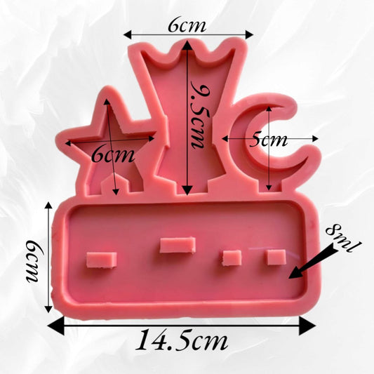 A mold in the shape of an incense burner, a crescent, and a star