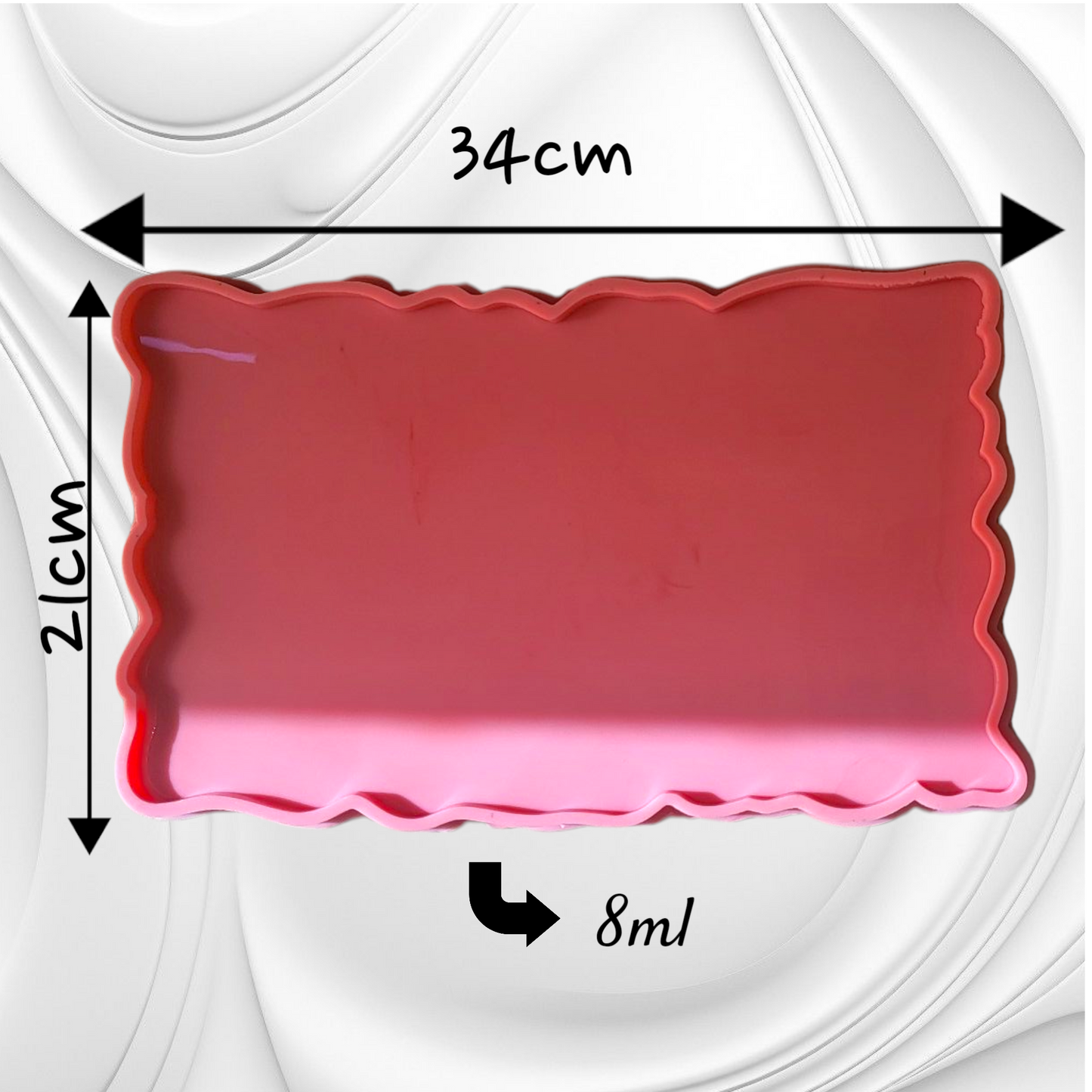 This silicone mold features a rectangular shape with irregular, serrated edges, giving the cast piece a natural appearance resembling gemstones or raw marble. It is suitable for resin, wax, or ceramics. Dimensions: 34*21 cm, Depth: 8 mm