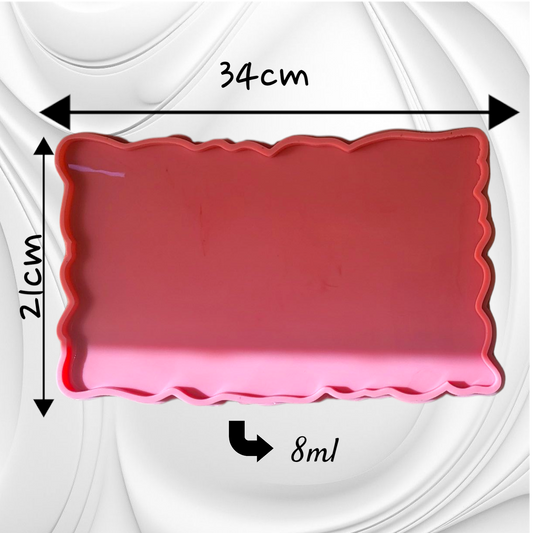 This silicone mold features a rectangular shape with irregular, serrated edges, giving the cast piece a natural appearance resembling gemstones or raw marble. It is suitable for resin, wax, or ceramics. Dimensions: 34*21 cm, Depth: 8 mm