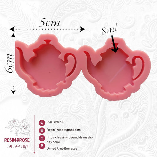 This silicone mold has two interconnected cavities, each designed in the shape of a teapot. This mold allows you to produce multiple identical pieces simultaneously with a small amount of material. Dimensions: 5 x 6 cm, Depth: 8 mm