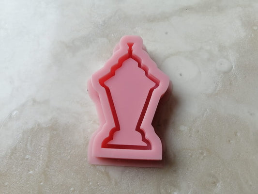 A silicone mold designed in the shape of a classic Ramadan lantern or incense burner with clear geometric details, used for casting resin, wax, or pottery. Ideal for making party favors, keychains, or small decorative pieces