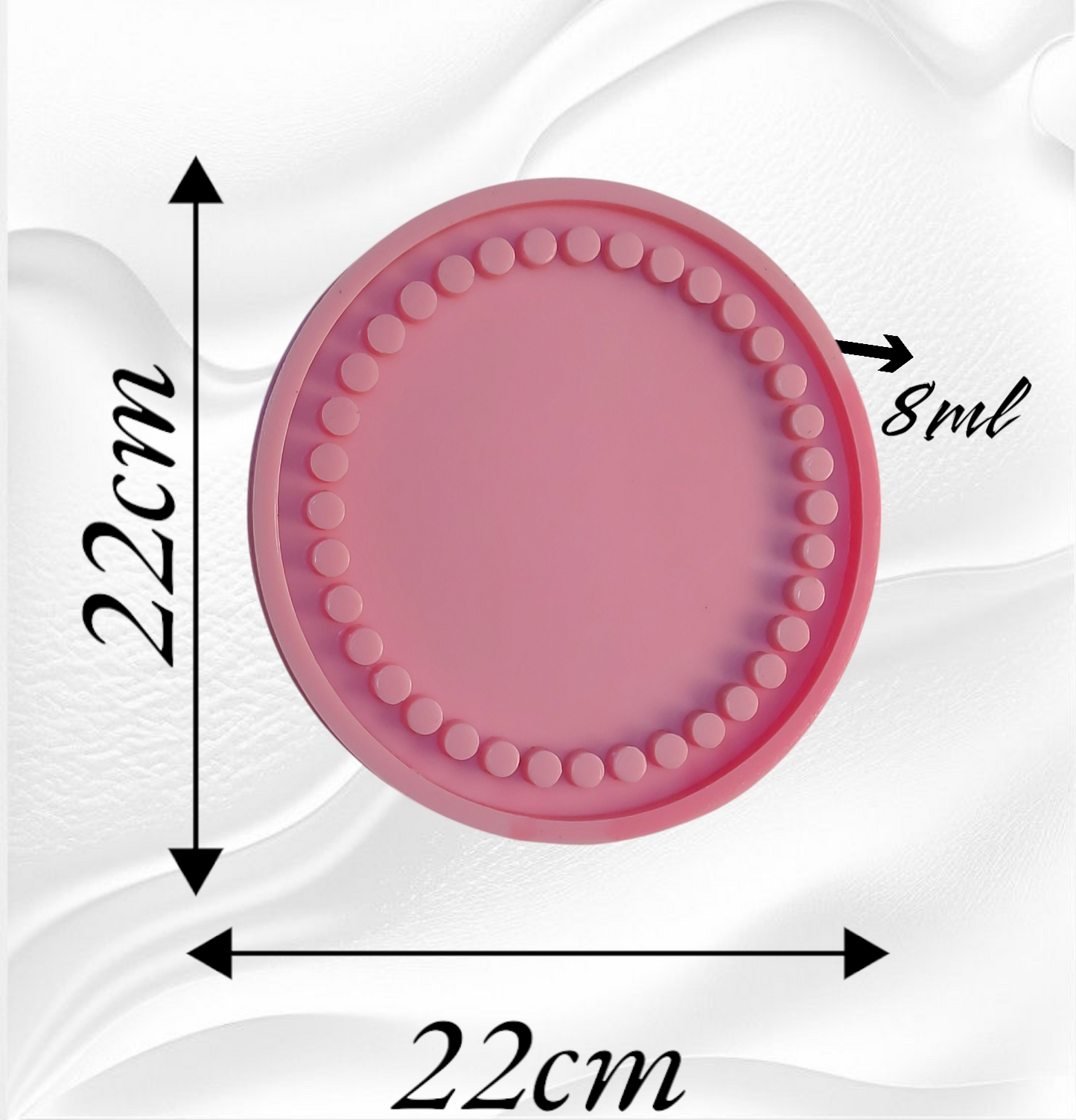 A round silicone mold designed for casting resin or plaster or pottery to create coasters or small decorative plates. It features small raised circles surrounding the flat center of the mold. Diameter: 22 cm. Depth: 8 mm.