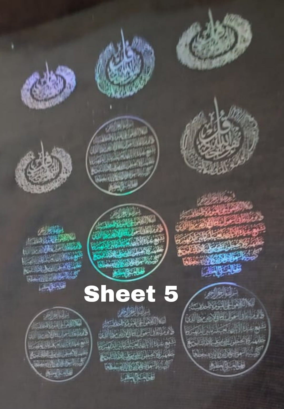 Transparent printed paper or stickers containing Quranic verses, supplications, and blessings This type of repeated text is used to be included inside resin molds, or to be glued onto car pendants and medals as handicrafts.