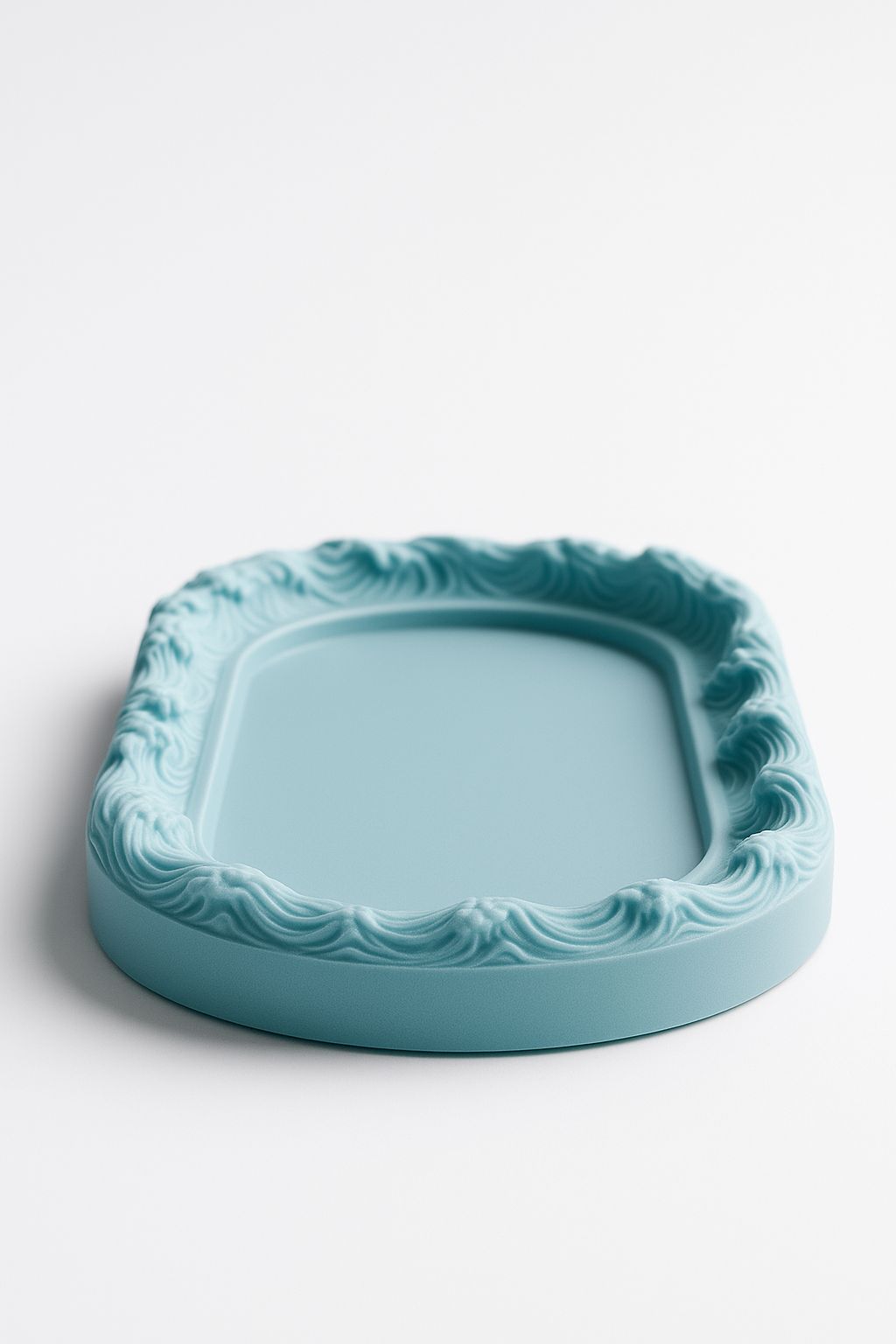 An oval-shaped silicone mold designed for casting decorative-edged trays. Suitable for resin, wax, ceramics, or polymer clay. Length: 12 cm  Width: 7 cm