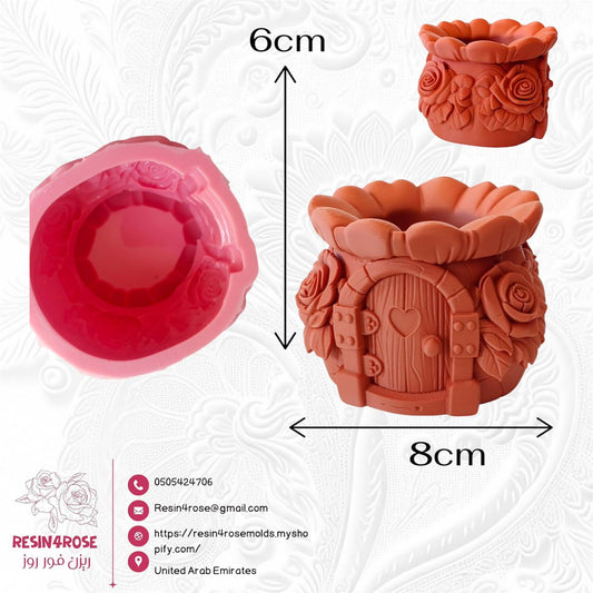 A silicone mold designed for crafts such as resin or wax plaster, shaped like a small house or "vase" decorated with rustic details and roses. Size: 6*8 cm