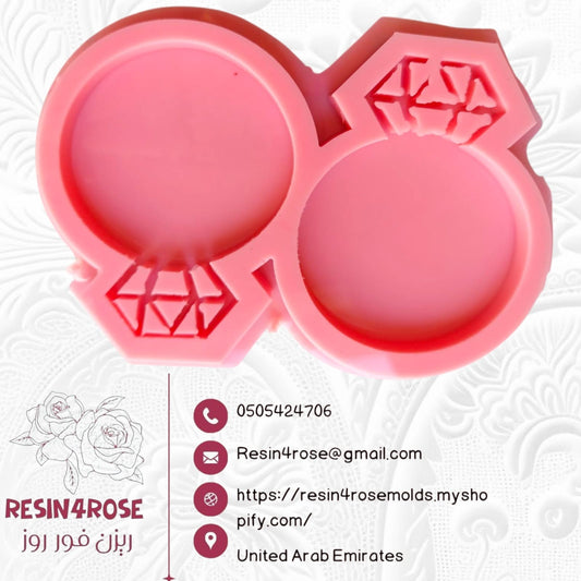 A silicone mold designed in the shape of an engagement or wedding ring, studded with diamonds connected and distributed in a symmetrical, reverse pattern.