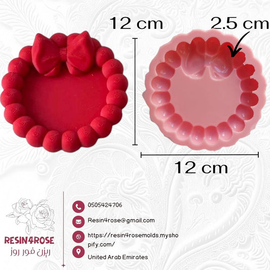 A pink silicone mold with large edges, primarily intended for crafts
