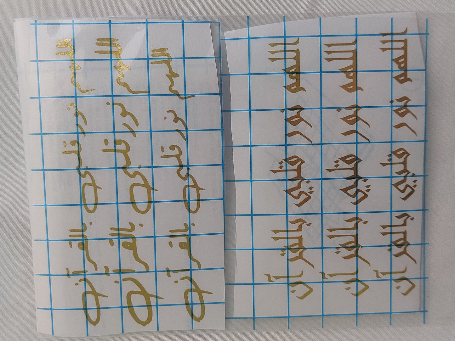 Vinyl, transparent printed paper, or stickers containing prayers. This type of repeated text is used to be placed inside the provided resin molds, or to be glued onto car pendants and medals as handicrafts